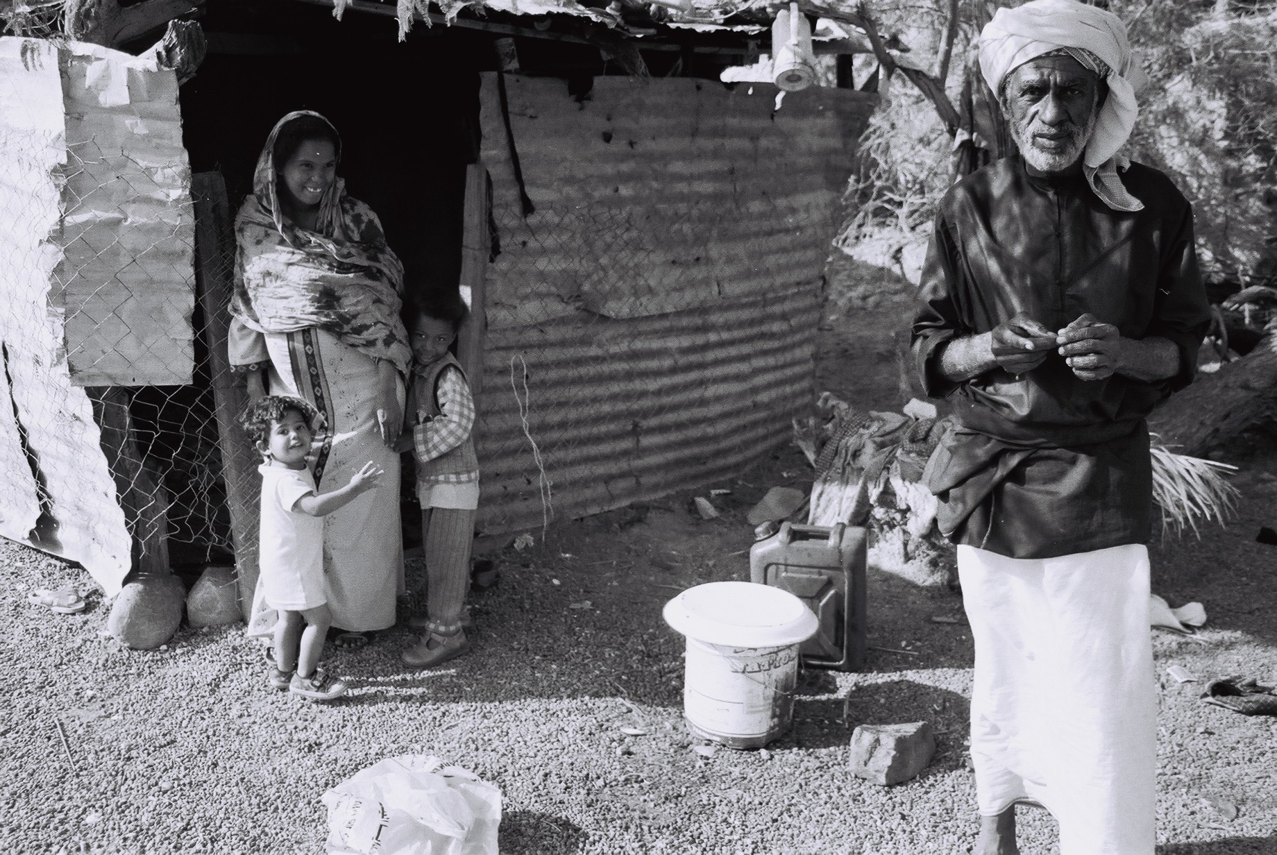 Black and white photograph of a family in the Arabian Oryx Protected Area